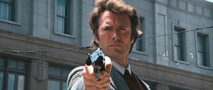 A still from the movie Dirty Harry, featuring Inspector Harry Callahan—portrayed by Clint Eastwood—brandishing a gun.