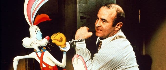 A still from Who Framed Roger Rabbit, featuring an animated Roger Rabbit handcuffed to Bob Hoskin's Eddie Valiant.